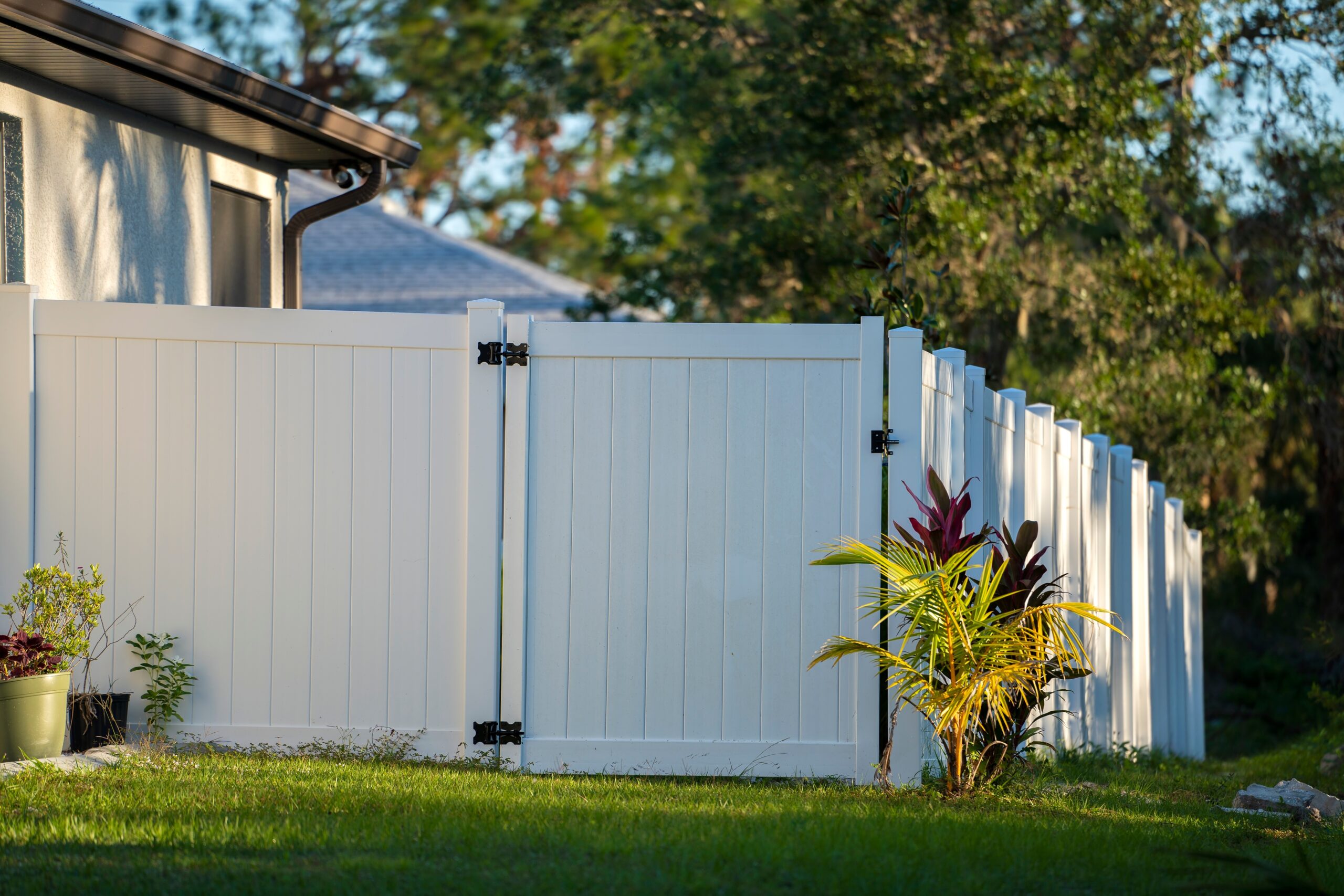 white fence on green lawn